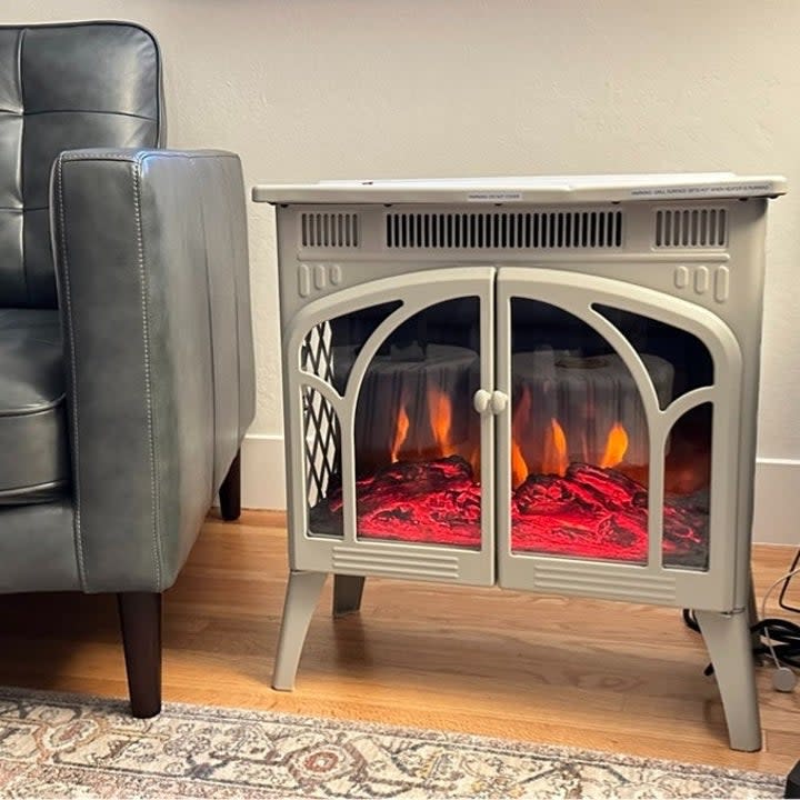 reviewer image of the beige fireplace