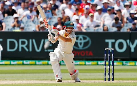 David Warner takes his top hand off the bat as he punches the ball into the off-side - Credit: Jason O'Brien/PA Wire