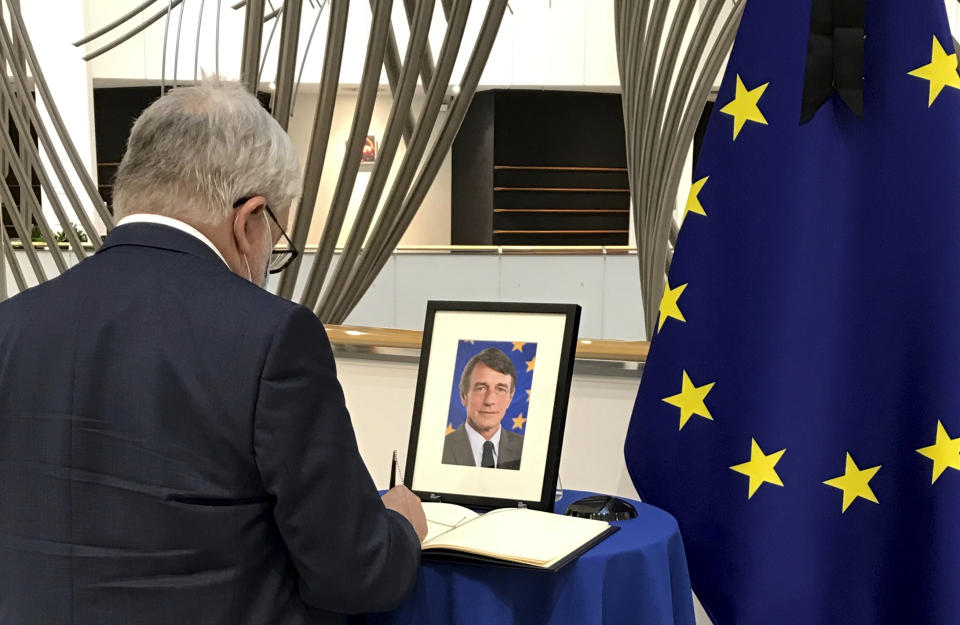 Hungarian MEP Attila Are Kovacs signs a condolence register, in honour of European Parliament President David Sassoli, at the European Parliament in Brussels, Tuesday, Jan. 11, 2022. David Sassoli, the Italian journalist who worked his way up in politics and became president of the European Union's parliament, died at a hospital in Italy early Tuesday, Jan. 11, 2022 his spokesperson said. (AP Photo/Mark Carlson)