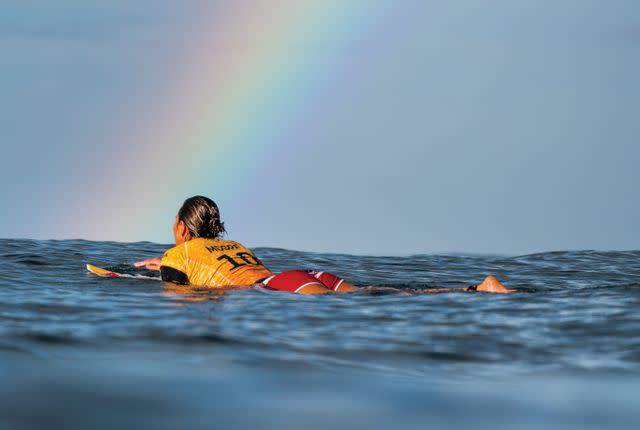 <p>Dayanidhi Das/World Surf League/Getty</p> Photo of five-time world champion surfer Carissa Moore paddling out into the lineup, featured in "Carissa Moore: Hawaii Gold: A Celebration of Surfing"