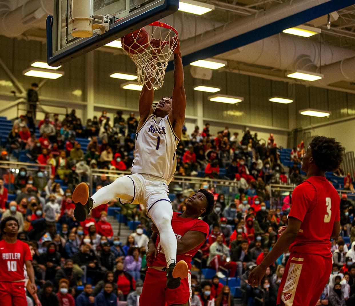 Male's Kaleb Glenn (1) slams home two of his 23 points as the Bulldogs defeated the Butler Bears 96-84 to win the 2022 Boys LIT Championship. January 15, 2022