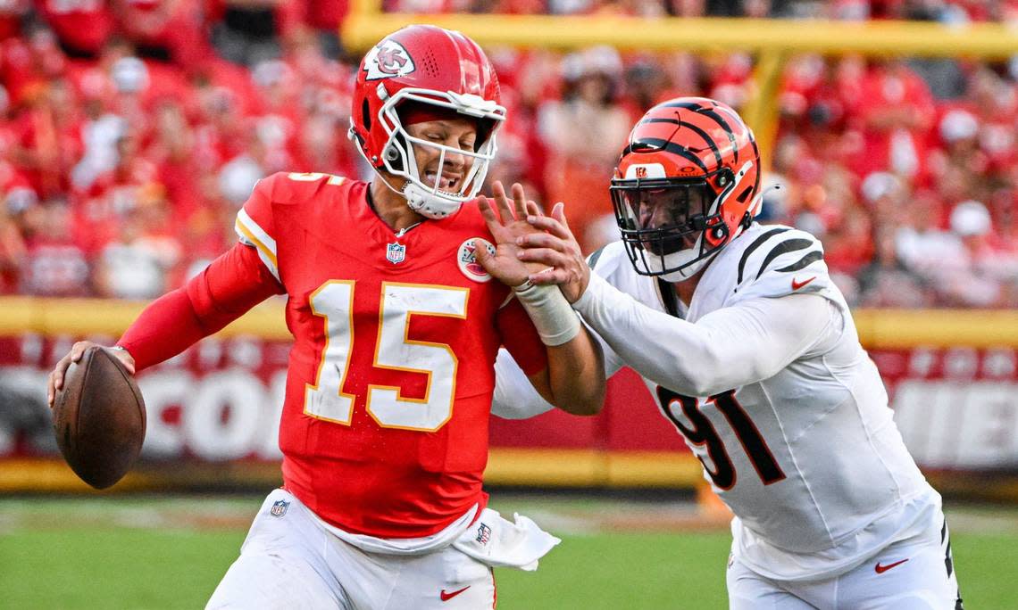 Kansas City Chiefs quarterback Patrick Mahomes (15) is pressured by Cincinnati Bengals defensive end Trey Hendrickson (91) in the third quarter Sunday, Sept. 15, 2024, at GEHA Field at Arrowhead Stadium.