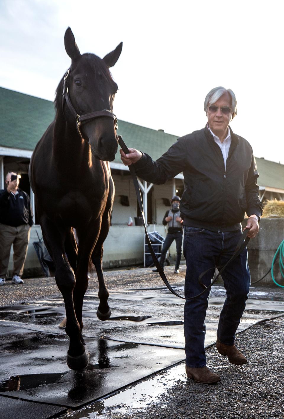 Trainer Bob Baffert leads Medina Spirit back to his stall on the morning after winning his seventh Kentucky Derby with the horse. One week later it was announced that Medina Spirit tested positive for an abundance of an anti-inflammatory drug following the race.