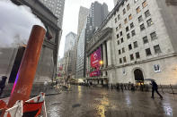 Steam rises from a vent at a work site near the New York Stock Exchange, center, on Wednesday, May 8, 2024, in New York. World shares are mostly higher after U.S. stocks held relatively steady on Wall Street. (AP Photo/Peter Morgan)