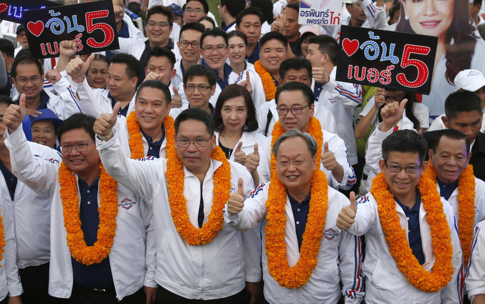 FILE - in this March 22, 2019, file photo, from left to right, Thailand's Suwit Mesinsee, Uttama Savanayana, Sontirat Sontijirawong and Kobsak Pootrakul, arrive for a campaign rally ahead of general elections in Bangkok, Thailand. Four key ministers in Cabinet announced their resignations Thursday, July 16, 2020 as a military clique within the ruling party continues to consolidate power. The most prominent member to depart was Somkid, a deputy prime minister who has been in several governments during the past 19 years and who has been overseeing recent economic stimulus packages. (AP Photo/Sakchai Lalit, File)