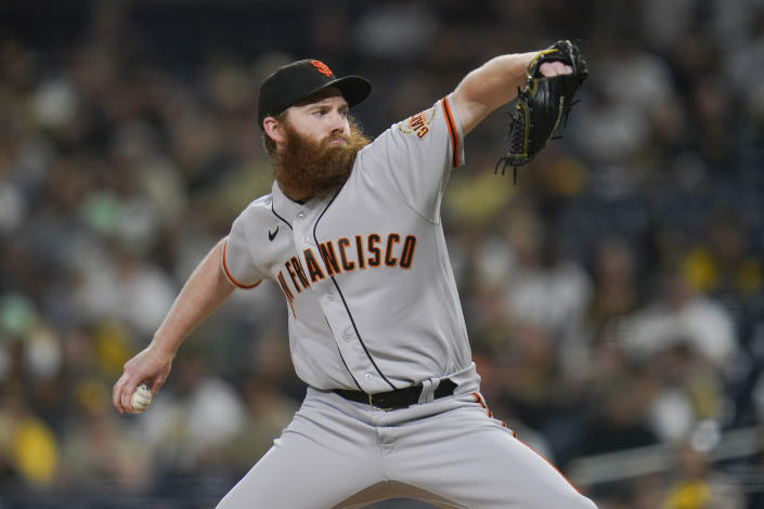San Francisco Giants starting pitcher John Brebbia works against a San Diego Padres batter during the first inning of a baseball game Monday, Oct. 3, 2022, in San Diego. (AP Photo/Gregory Bull)