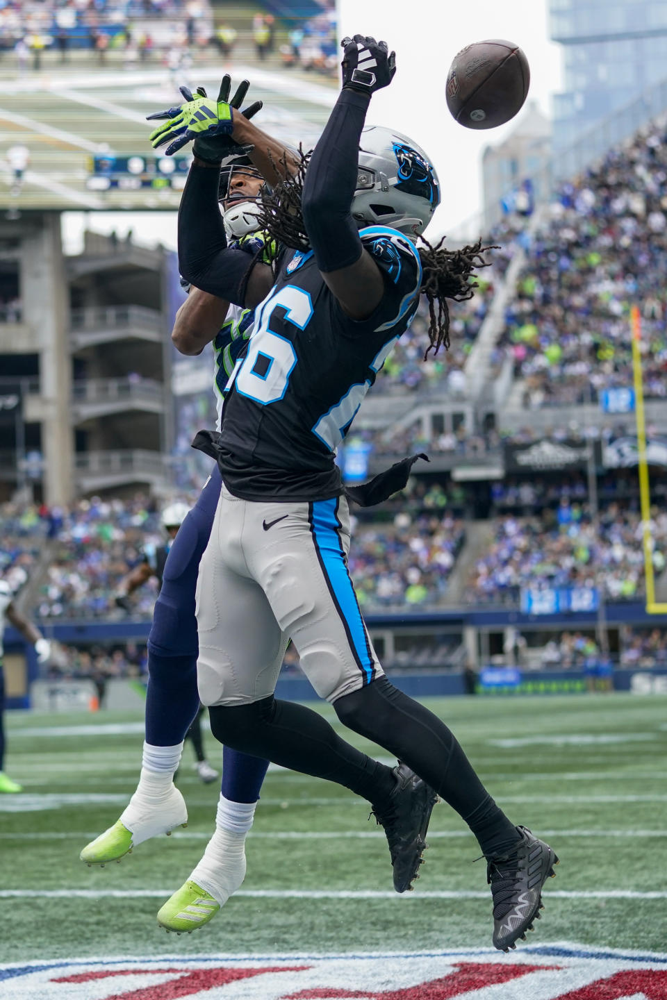 Carolina Panthers cornerback Donte Jackson breaks up a pass intended for Seattle Seahawks wide receiver Tyler Lockett during the first half of an NFL football game Sunday, Sept. 24, 2023, in Seattle. (AP Photo/Lindsey Wasson)