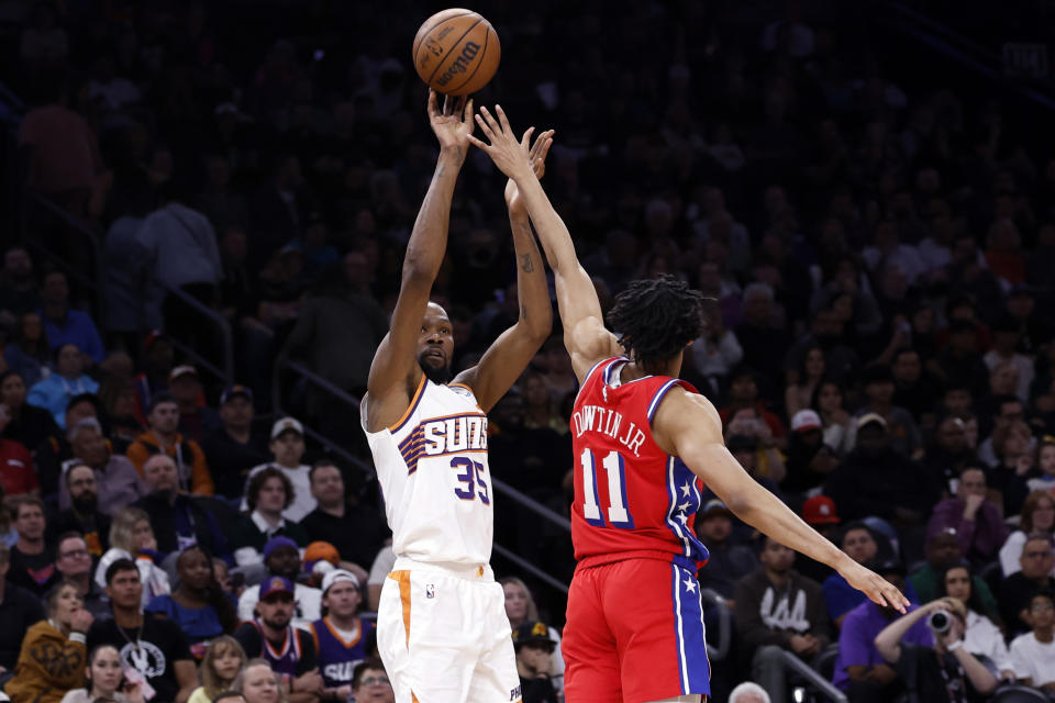 PHOENIX, ARIZONA - MARCH 20: Kevin Durant #35 of the Phoenix Suns shoots against Jeff Dowtin Jr. #11 of the Philadelphia 76ers during the second half at Footprint Center on March 20, 2024 in Phoenix, Arizona. NOTE TO USER: User expressly acknowledges and agrees that, by downloading and or using this photograph, User is consenting to the terms and conditions of the Getty Images License Agreement.  (Photo by Chris Coduto/Getty Images)