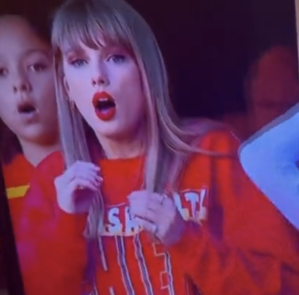 Close-up of Taylor looking shocked in the VIP lounge