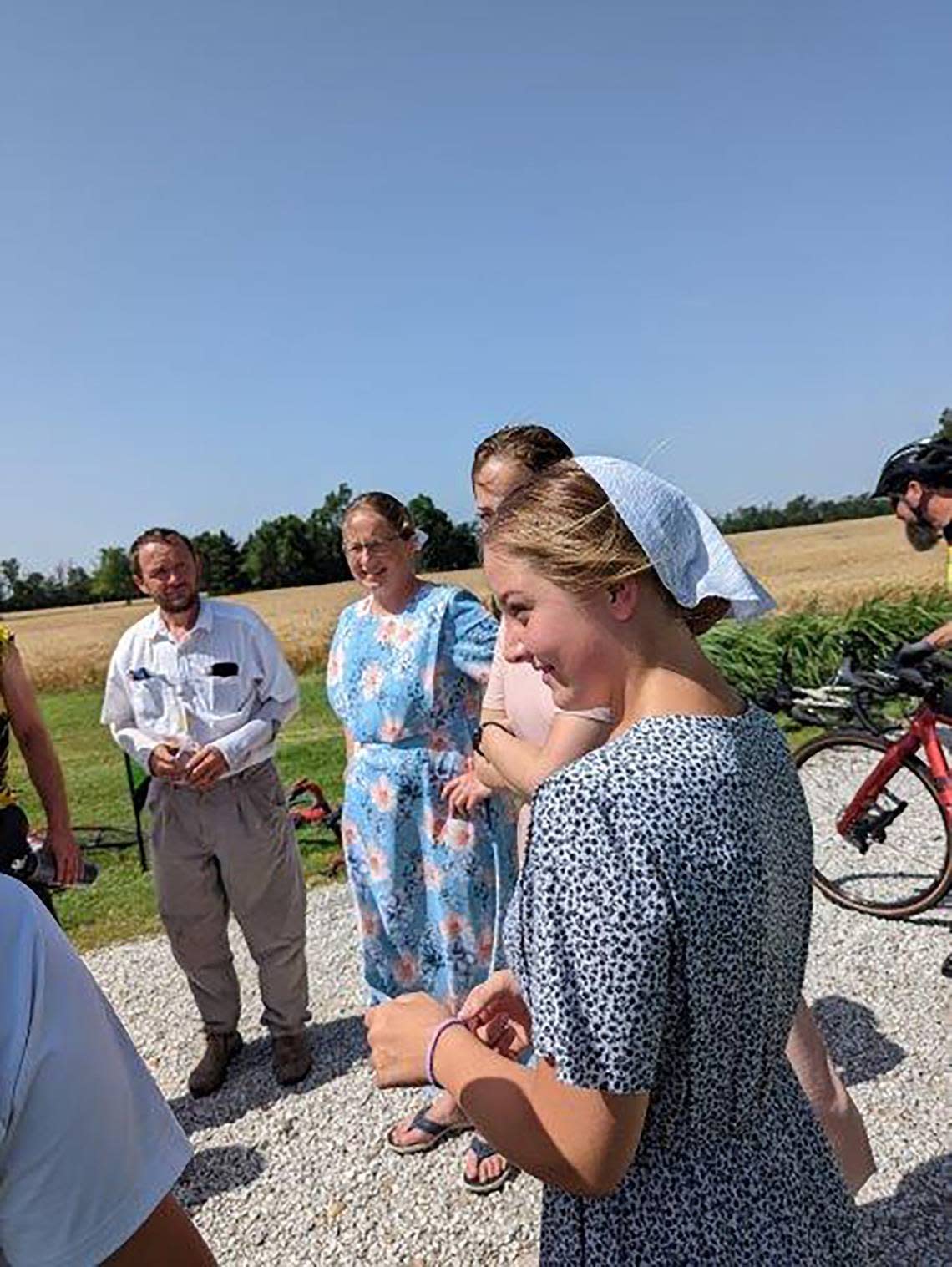 Biking across Kansas cyclers visit with some of the local residents near Partridge, Kansas.