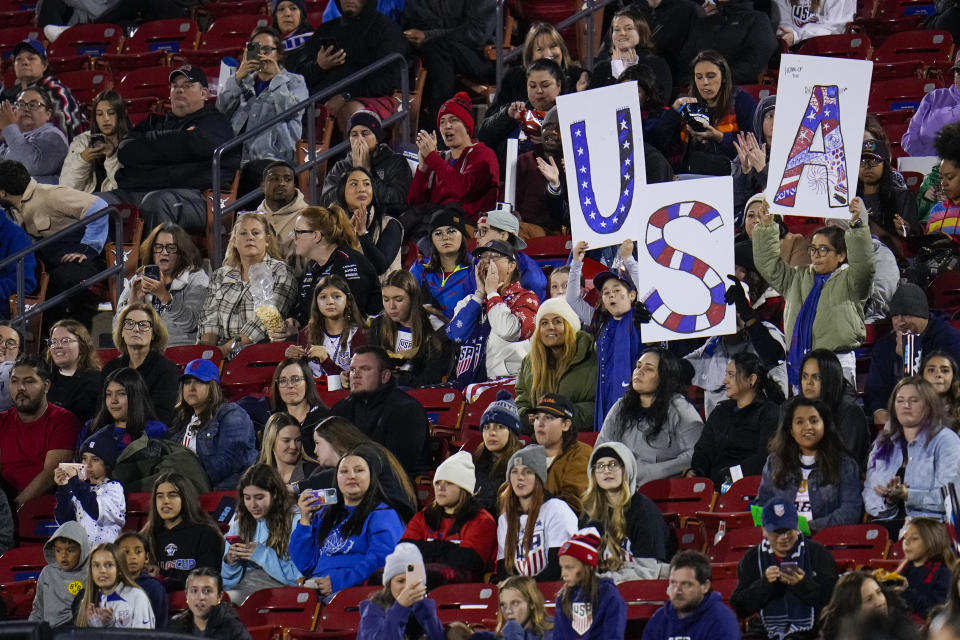 Spectators watch the second half of a women's international friendly soccer match between the United States and China, Tuesday, Dec. 5, 2023, in Frisco, Texas. (AP Photo/Julio Cortez)