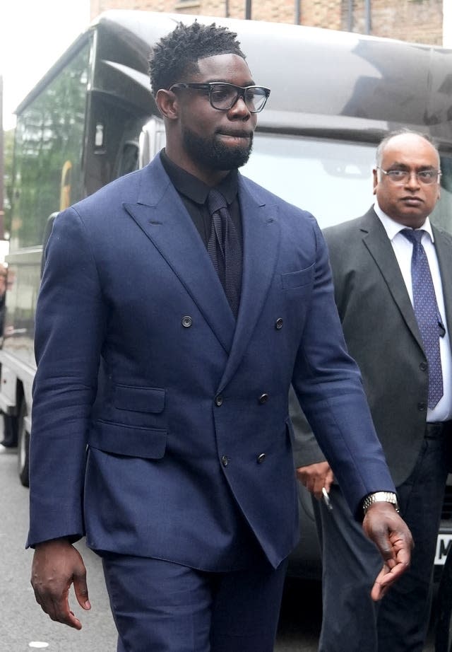 Sky Sports pundit Micah Richards leaves court in a blue suit 