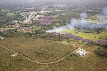 The flow of lava from the Kilauea Volcano is pictured near the village of Pahoa, Hawaii in this October 27, 2014 NASA satellite handout photo. REUTERS/NASA/Handout via Reuters