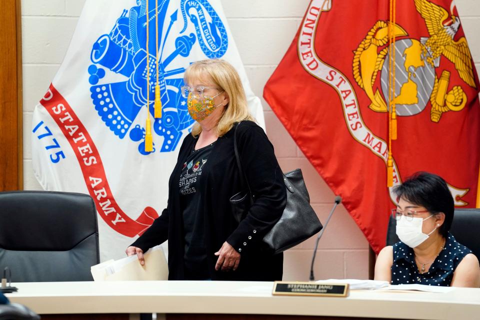 Palisades Park councilwoman Cyndy Pirrera walks back to her seat after threatening to leave during a borough council meeting on Monday, May 23, 2022.