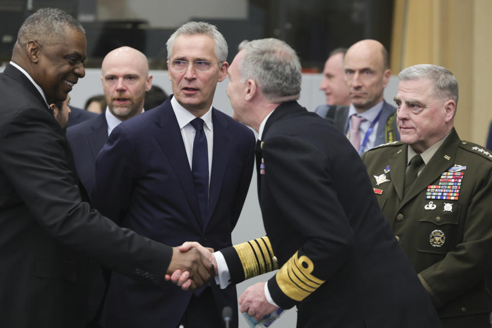 United States Secretary of Defense Lloyd Austin, left, NATO Secretary General Jens Stoltenberg, center left,and Joint Chiefs Chairman Gen. Mark Milley, right, are seen during the North Atlantic Council round table meeting of NATO defense ministers at NATO headquarters in Brussels, Tuesday, Feb. 14, 2023. (AP Photo/Olivier Matthys)