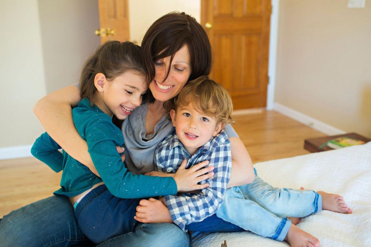 Mila with her mother and brother