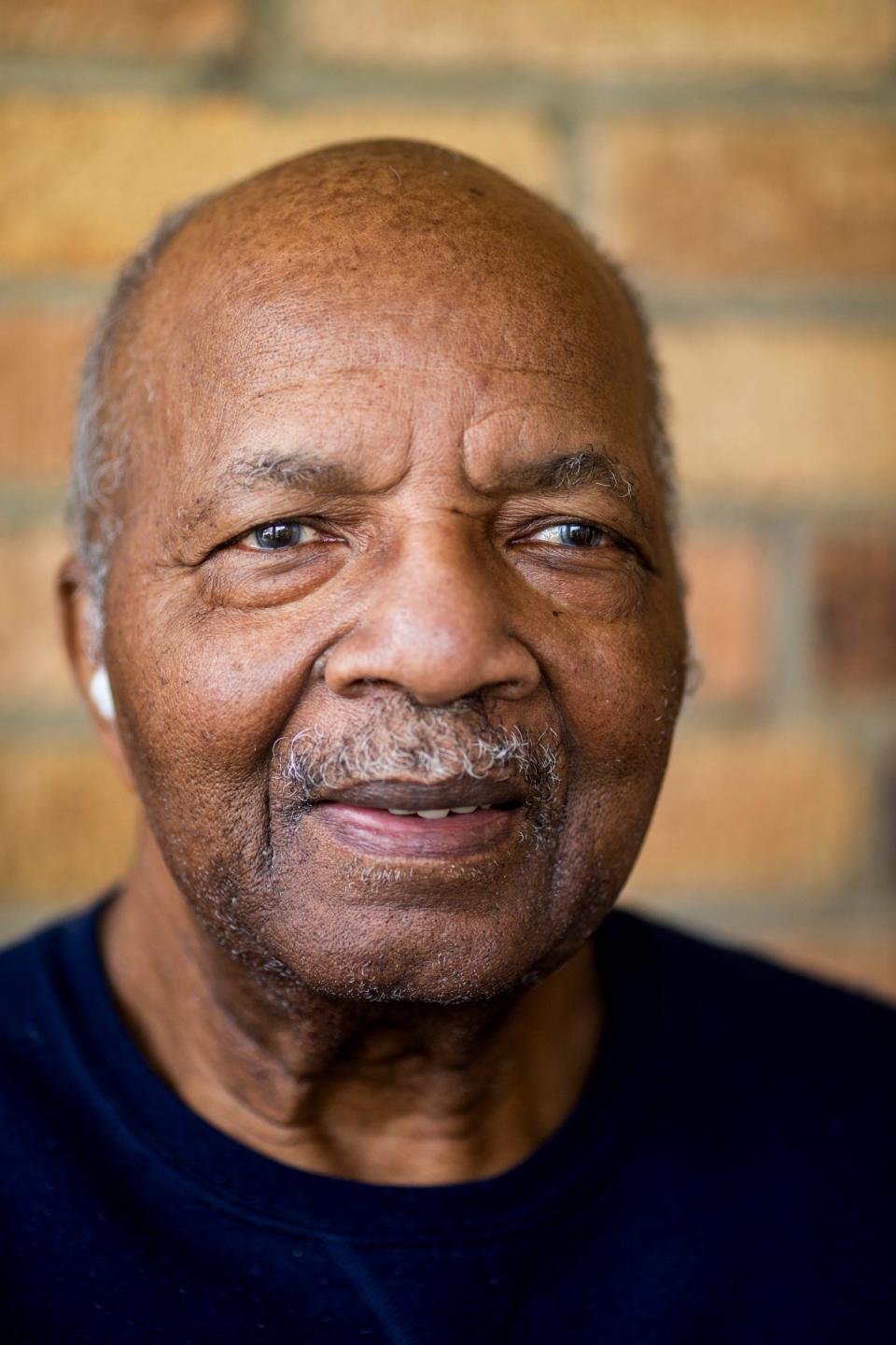 Al Hill sits on the front porch of his home in Kennedy Heights on Tuesday, April 6, 2021. Al and his wife Ann fostered 100 girls in their lifetime. Al said, "We made our home for everybody." 