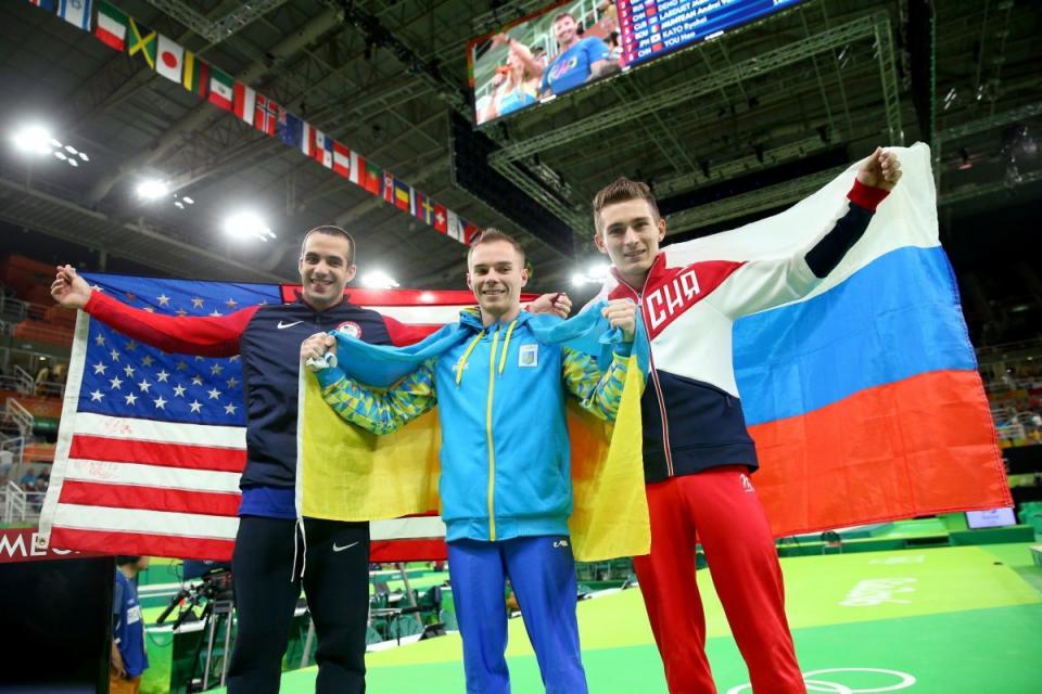 Danell Leyva, left, celebrates his silver medal (Getty Images)