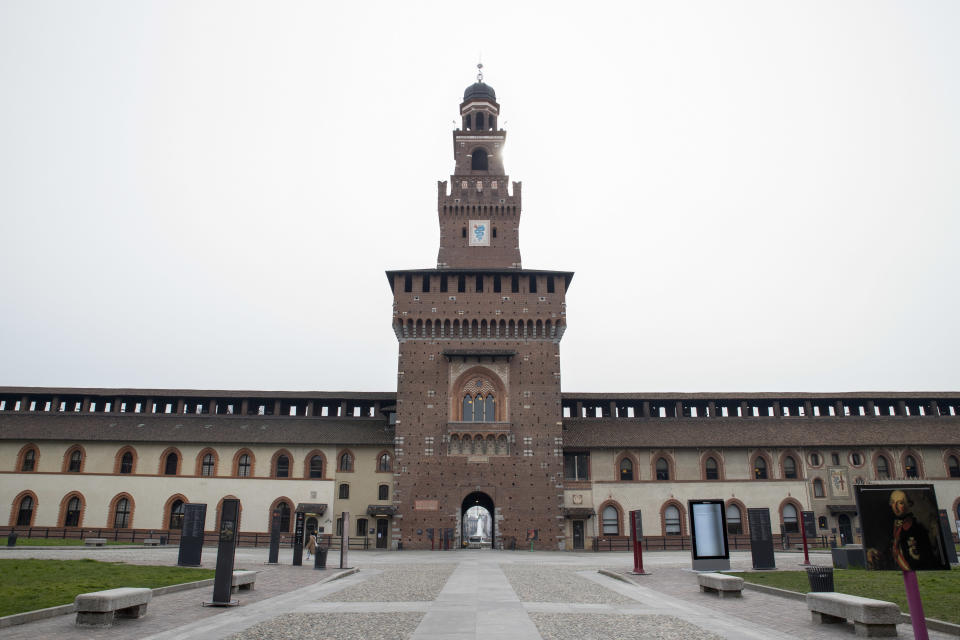 A single pedestrian passes Sforzesco Castello in Milan, Italy, on Tuesday, March 10, 2020. (Credit: Camilla Cerea/Bloomberg)