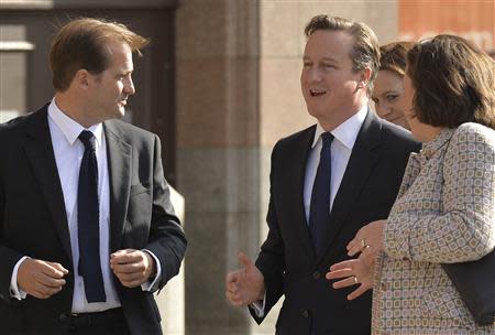 Britain's Prime Minister David Cameron (C) arrives on the first day of the Conservative Party annual conference in Manchester northern England September 29, 2013. REUTERS/Toby Melville