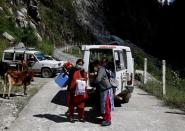 The Wider Image: Doctors scale rockslides, invoke gods to vaccinate Himalayan villages