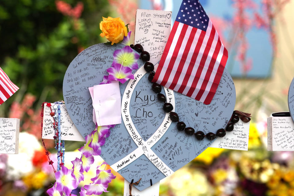 FILE - A cross with the name Kyu Cho, a victim of a mass shooting stands at a makeshift memorial by the mall where several people were recently killed, May 10, 2023, in Allen, Texas. So far this year, the nation has witnessed the highest number on record of mass killings and deaths to this point in a single year. There have been more than 550 mass killing incidents since 2006, according to the database, in which at least 2,900 people have died and at least 2,000 people have been injured. (AP Photo/Tony Gutierrez, file)