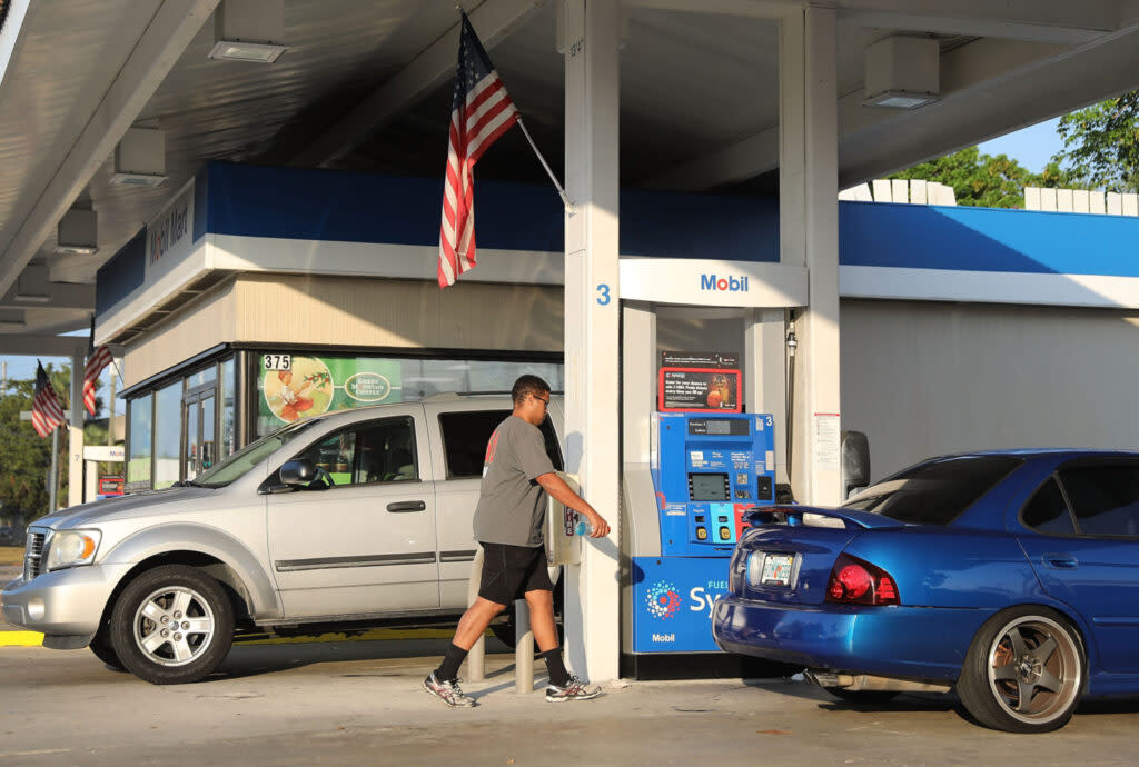 Customers use a gas station on April 9, 2018, in Miami, Florida. (Joe Raedle/Getty Images)