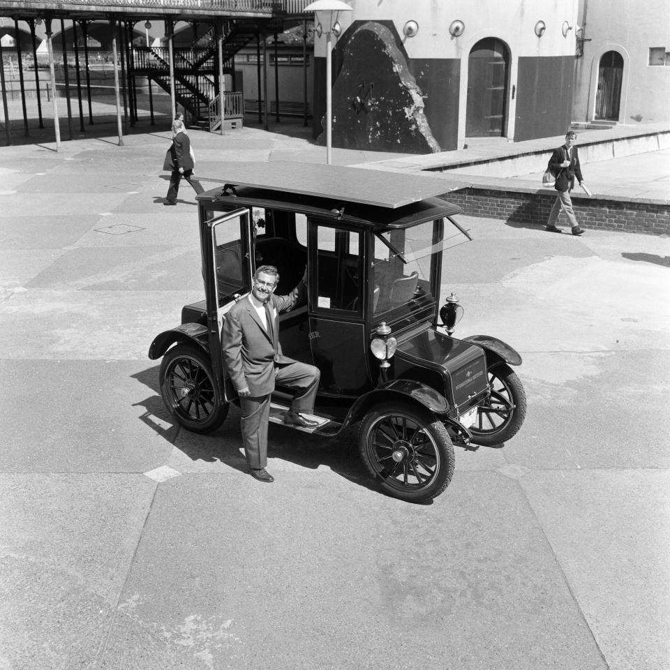 A revolutionary car driven by sun power. Dr Charles Escoffery with his veteran car, showing the solar cells on the roof. Dr Charles Escoffery is a scientist from El Segundo, California, who has pioneered development of solar cells, 9th August 1960. (Photo Charlie Ley/Mirrorpix/Getty Images)  - Getty