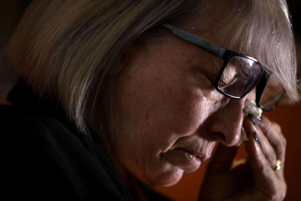 In this picture taken on Friday, Jan. 31, 2020 Yolanda Martinez Garcia cries during an interview with the Associated Press at her home, in Milan. Her son was sexually abused by one of the priests of the Legion of Christ, a disgraced religious order. (AP Photo/Luca Bruno)