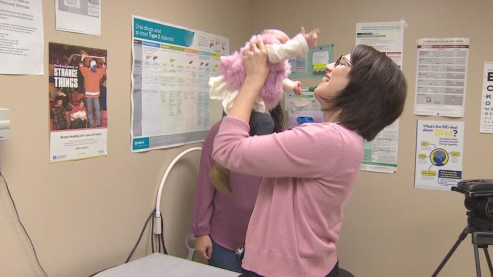 Dr. Lynette Powell with a young patient in Grand Falls-Windsor.