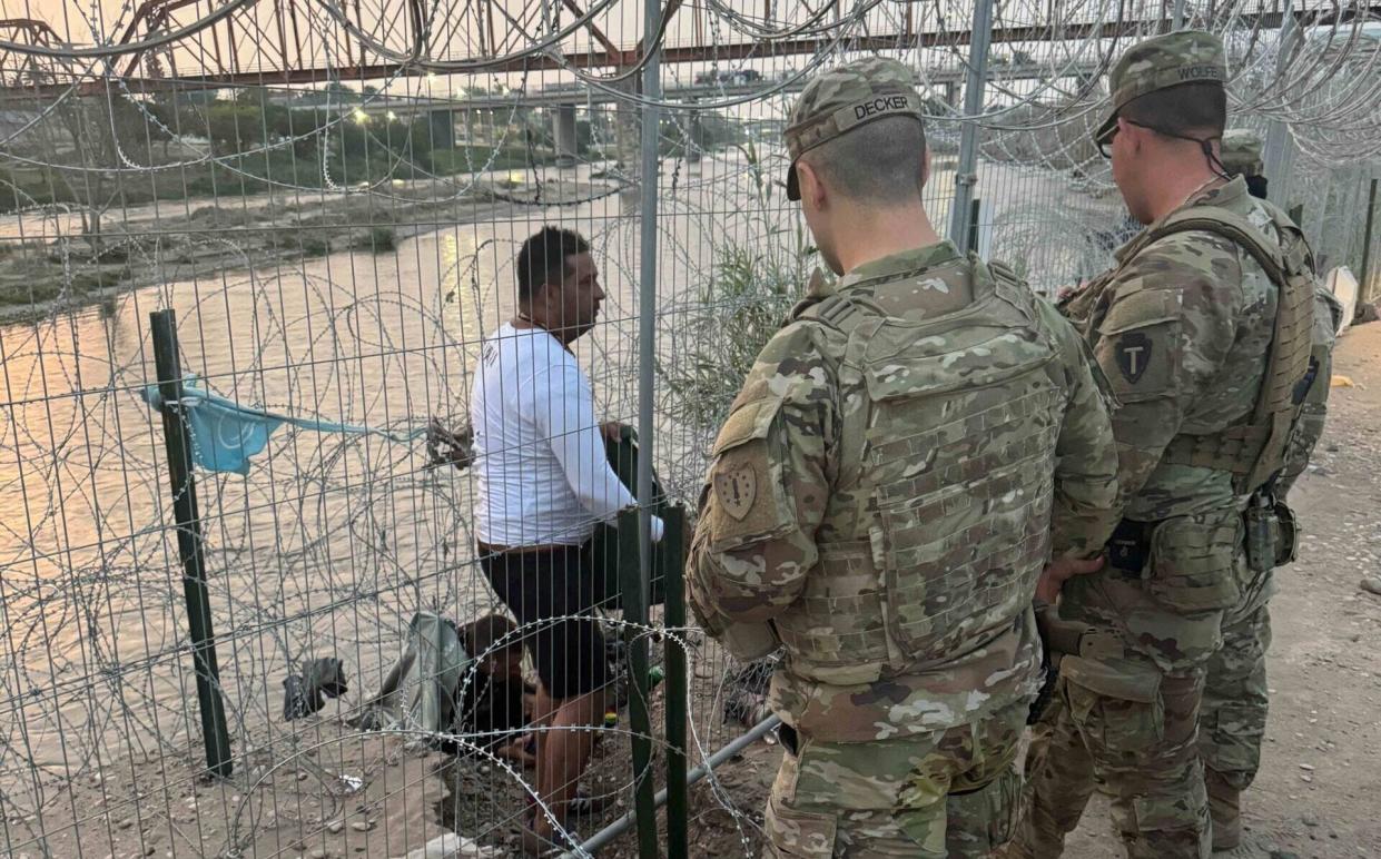 The 15 National Guard soldiers Gov. Chris Sununu deployed to Texas this month are assisting with border security. Sgt. Connor Decker and soldiers from other states direct a man attempting to enter illegally to an official border crossing.