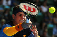 Canada's Milos Raonic hits a shot during his fourth round match against Switzerland's Stan Wawrinka at the Australian Open tennis tournament at Melbourne Park, Australia, January 25, 2016. REUTERS/Thomas Peter