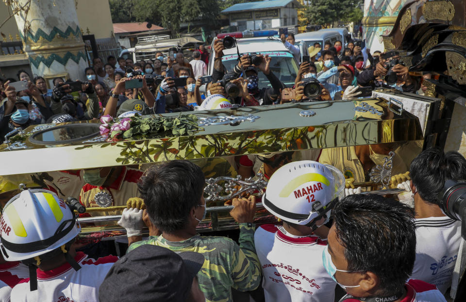 People carry the coffin of Thet Naing Win in Mandalay, Myanmar, Tuesday, Feb. 23, 2021. A funeral was held for Thet Naing Win, one of two protesters shot dead by security forces on Saturday. (AP Photo)