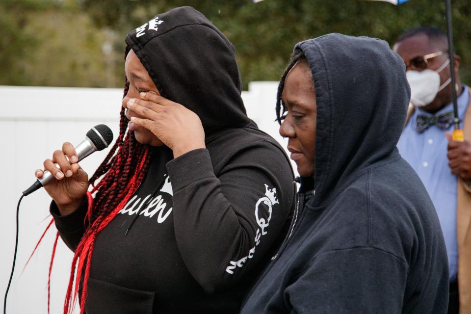 Chanice Johnson wipes a tear from her cheek while her mother consoles her while speaking to members of the media about the struggles she and her family have experienced with finding new housing after the mobile home park they lived in was bought out and the rent prices were severely increased Tuesday, Jan. 25, 2022.