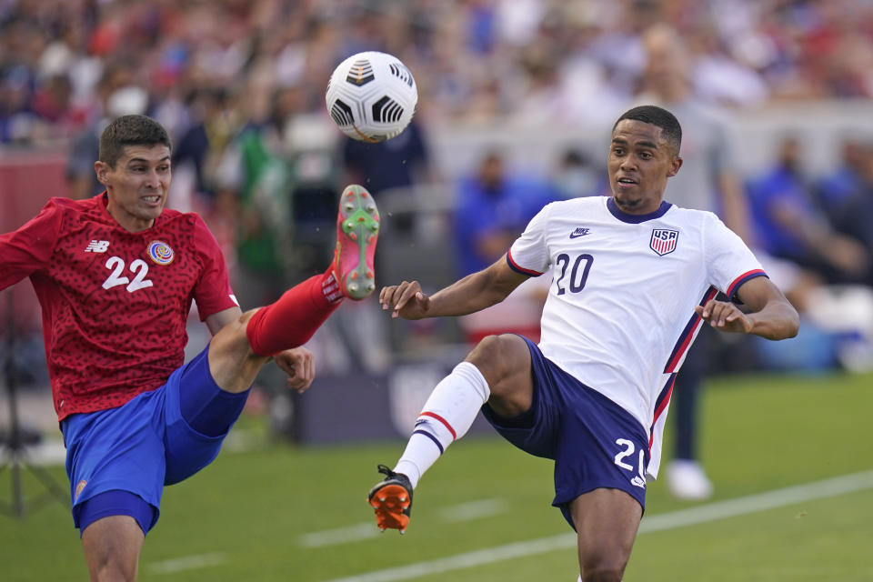 United States' Reggie Cannon (20) and Costa Rica's Ronald Matarrita (22) vie for the ball during the second half during an international friendly soccer match Wednesday, June 9, 2021, in Sandy, Utah. (AP Photo/Rick Bowmer)