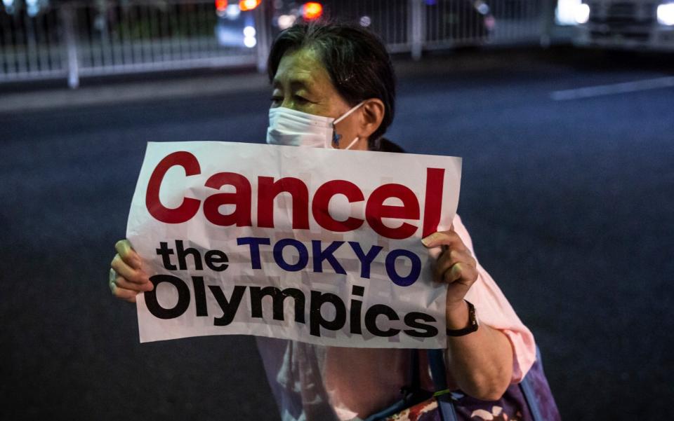 A woman at a demonstration in Tokyo on Friday - Yuichi Yamazaki/Getty Images