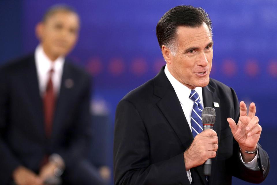 FILE - In this Oct. 16, 2012, file photo, Republican presidential candidate, former Massachusetts Gov. Mitt Romney speaks while President Barack Obama listens during the second presidential debate at Hofstra University in Hempstead, N.Y. When it comes to debates, Mitt Romney loves the rules. The eyes of millions of voters upon him, the Republican candidate is quick to poke holes in his rival's arguments. But he's just as ready to take the moderator to task when he believes the predetermined ground rules have been breached. (AP Photo/David Goldman, File)