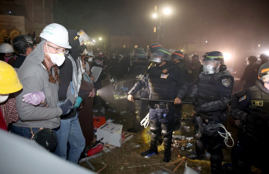 LOS ANGELES CA MAY 2, 2024 — Police and protestors face off on the UCLA campus Thursday, May 2, 2024. (Jason Armond / Los Angeles Times via Getty Images)