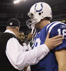 Rex Ryan, left, and Darrelle Revis, center, are greeted by Peyton Manning after the Jets defeated the Colts 17-16