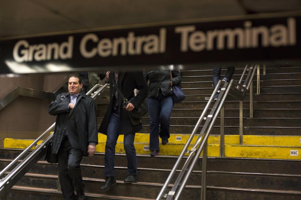 Commuters walk down a flight of stairs inside of Grand Central Station in New York, February 1, 2013. Grand Central Terminal, the doyenne of American train stations, is celebrating its 100th birthday. Opened on Feb. 2, 1913 the iconic New York landmark with its Beaux-Arts facade is an architectural gem, and still one of America's greatest transportation hubs. (REUTERS/Lucas Jackson)