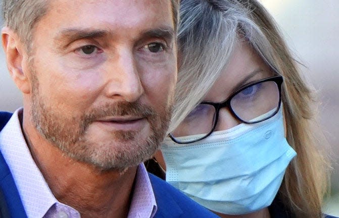 Dr. Peter Grossman walks out of Van Nuys courthouse with his wife, Rebecca Grossman, in late January.