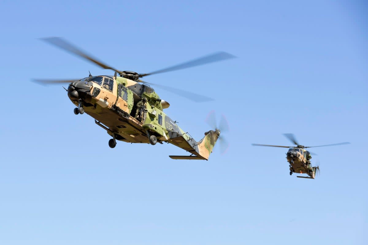 Army MRH-90 Taipan helicopters prepare to land at Townsville, Australia (© Commonwealth of Australia, Department of Defence)