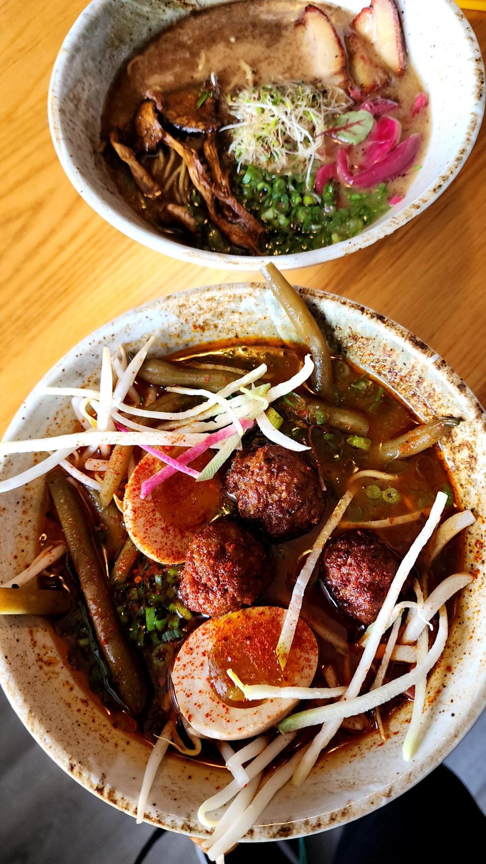 Yagi Noodles ramen bowls include Spicy Duck Miso with duck meatballs and Tonkotsu, rear, made with rich pork broth.