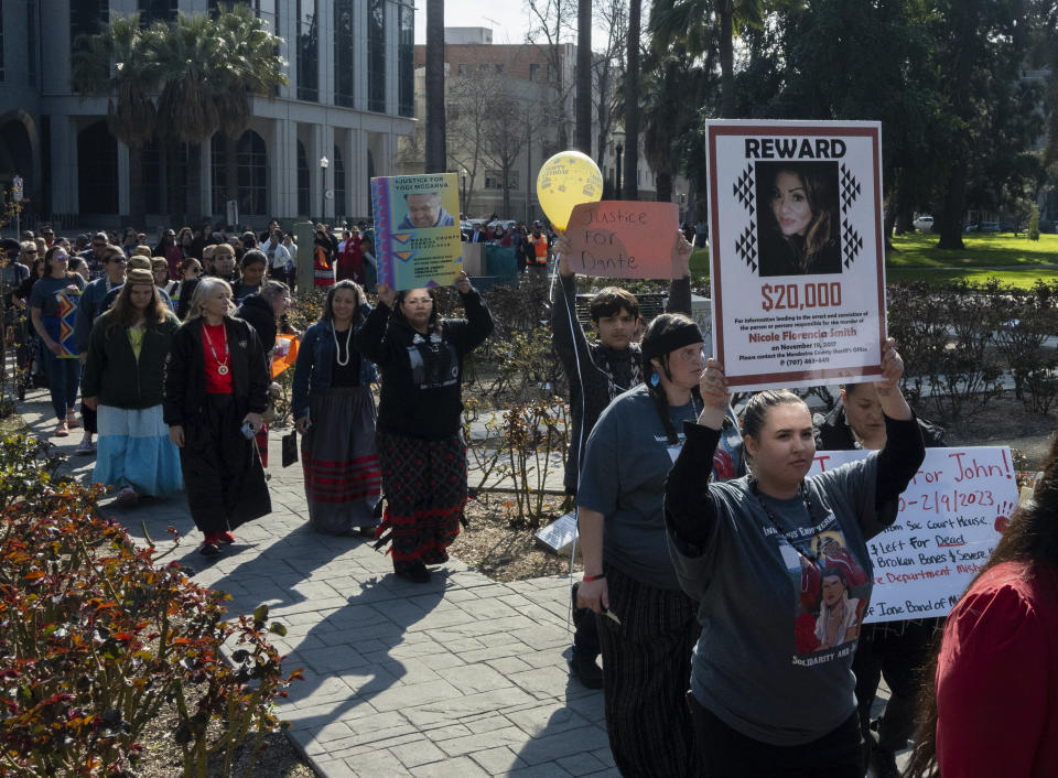 Family and friends of the missing and murdered march around the California State Capitol at the second annual Missing and Murdered Indigenous People Summit and Day of Action on Tuesday, Feb. 13, 2024, in Sacramento, Calif. (AP Photo/Jose Luis Villegas)