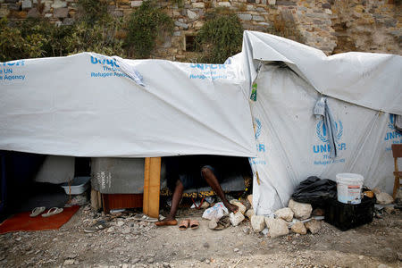 A migrant rests inside a tent at the Souda municipality-run camp on the island of Chios, Greece, September 6, 2016. REUTERS/Alkis Konstantinidis/File Photo