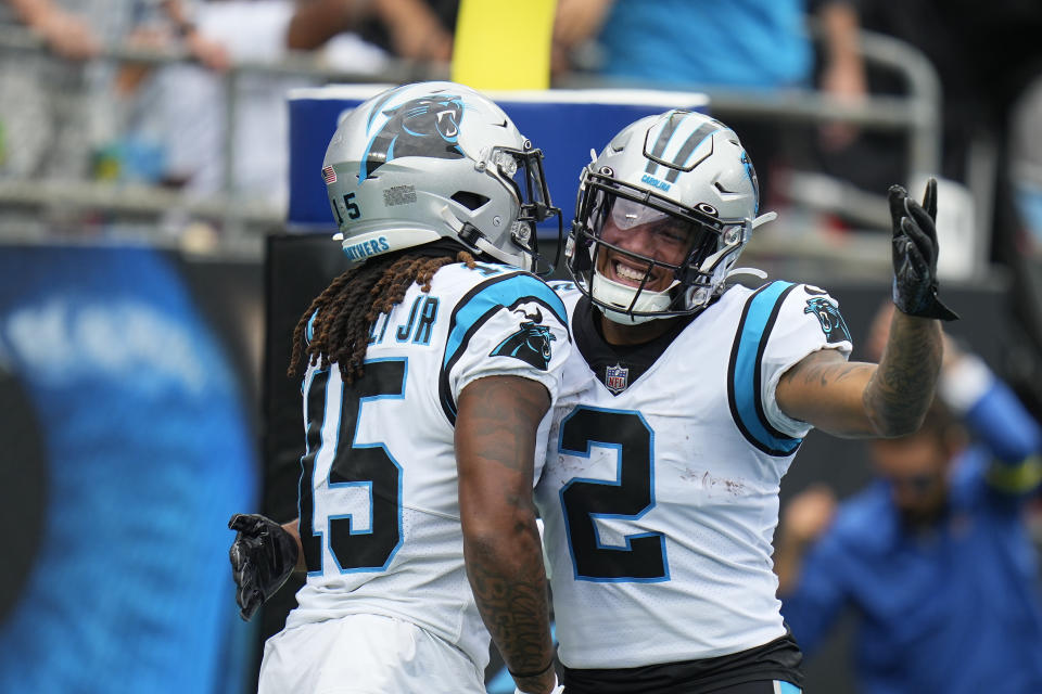 Carolina Panthers wide receiver Laviska Shenault Jr. (15) celebrates a 67 yard touchdown with wide receiver DJ Moore (2) during the second half of an NFL football game against the, Sunday, Sept. 25, 2022, in Charlotte, N.C. (AP Photo/Rusty Jones)