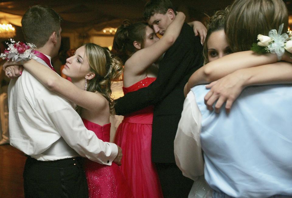 Cabrini High School junior Danielle DiMaggio (L) and boyfriend Ben Navo dance at the Cabrini High School prom May 12, 2006 in New Orleans, Louisiana.