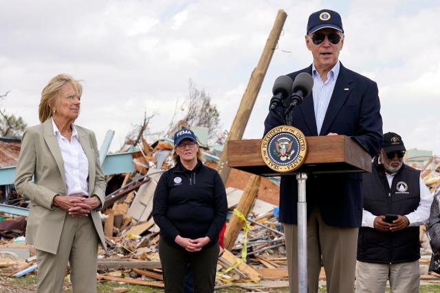 First lady Jill Biden listens as President Joe Biden speaks after surveying the damage in Rolling Fork, Miss., Friday, March 31, 2023, after a deadly tornado and severe storm moved through the area. (AP Photo/Carolyn Kaster)