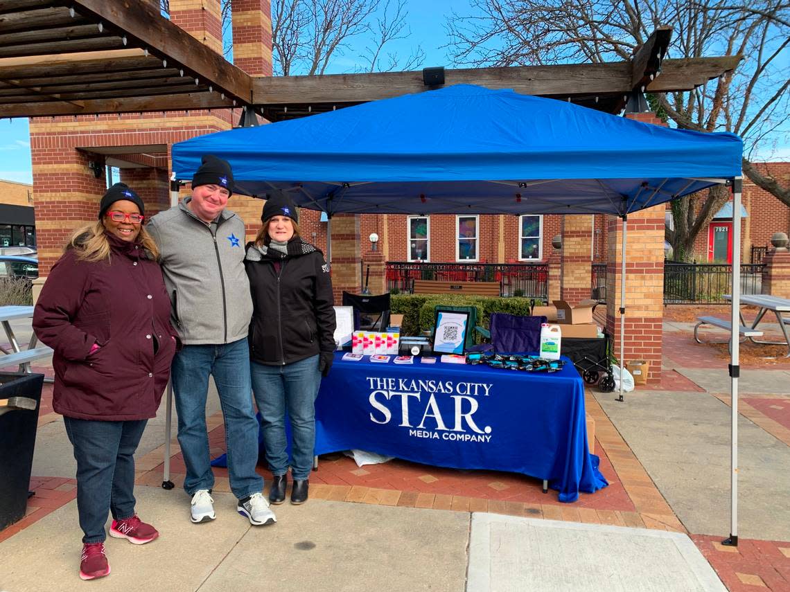 The Star’s Yvette Walker, Greg Farmer and Laura Bauer distribute naloxone and resource guides at the Overland Park Farmers’ Market. Allison Dikanovic