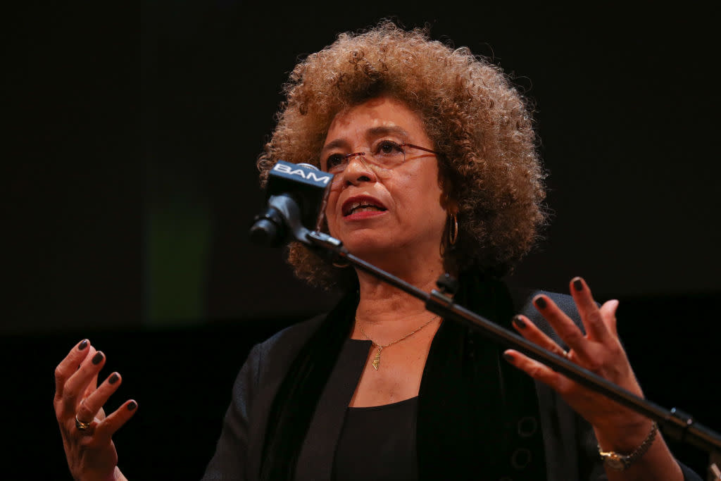 Check out these inspiring Black History Month Quotes. Pictured: Angela Davis speaking at a tribute for Dr. Martin Luther King Jr. | NEW YORK, NY - JANUARY 20:  Activist Angela Davis attends the 28th Annual Brooklyn Tribute to Dr. Martin Luther King Jr. at BAM Howard Gilman Opera House on January 20, 2014 in New York City.  (Photo by Charles Norfleet/Getty Images)